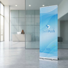 Load image into Gallery viewer, Retractable Roller Banner — Exhibition Hall Lifestyle | Generated by Modelize